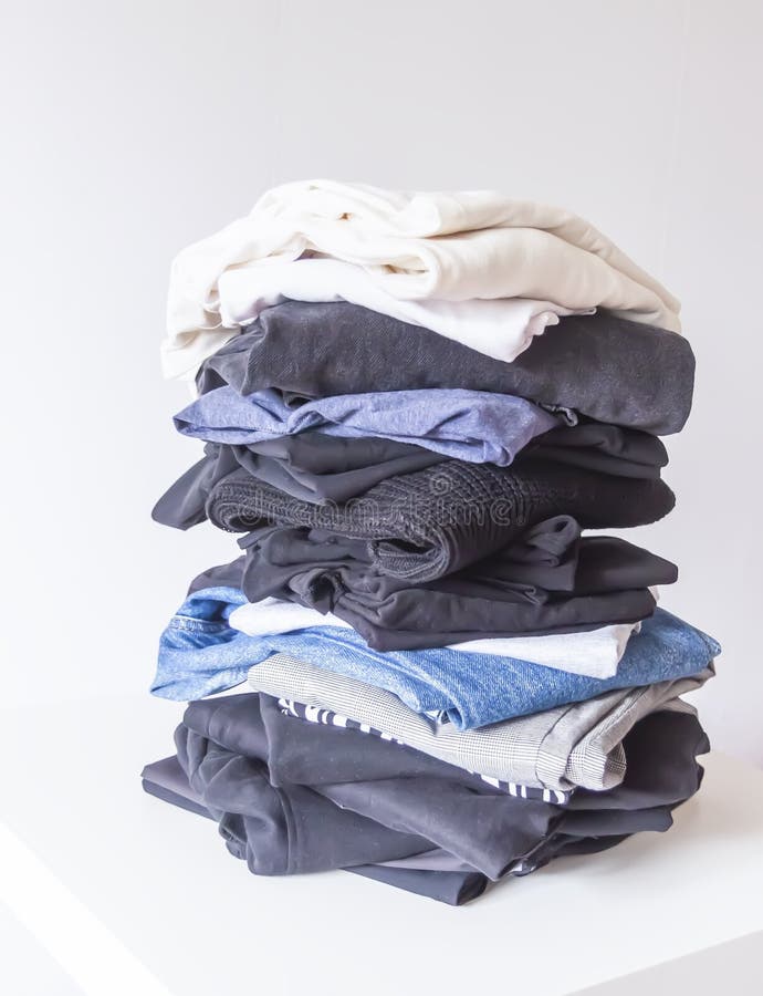 Folded Colorful Clothes in Stack. Home Organizing. Domestic Storage