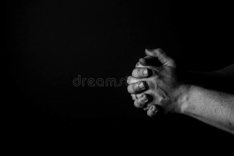 Folded Hands. Hands of a man folded, Praying. Thinking, Wondering, Concerning. Black and white. Folded Hands. Hands of a man folded, Praying. Thinking, Wondering, Concerning. Black and white.