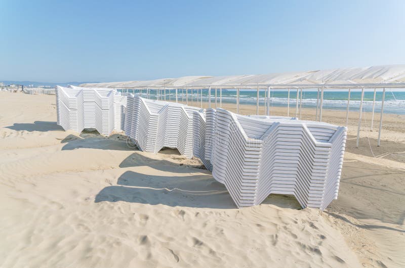 Folded Stack of White Plastic Deck Chairs Stock Photo Image of empty