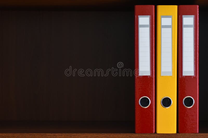 Folders for documents in the closet on the shelf in the office, files, copy space, background, close-up, office supplies