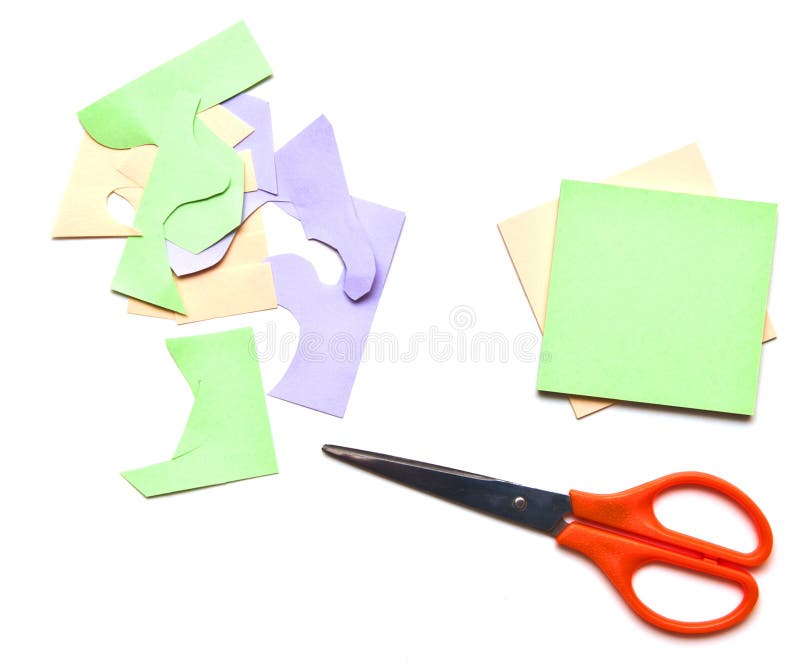 Folding colored leaves and a scissor