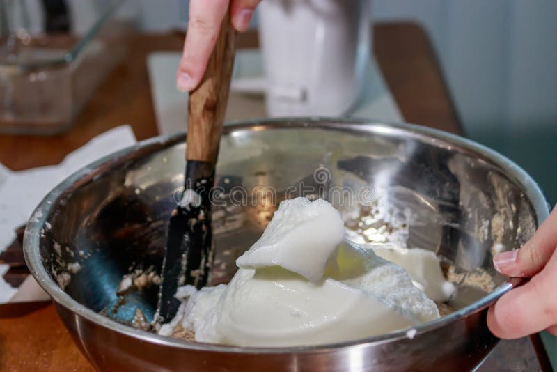 Folding Cake Batter Together with Shaved Chocolate in Background Stock Image Image of