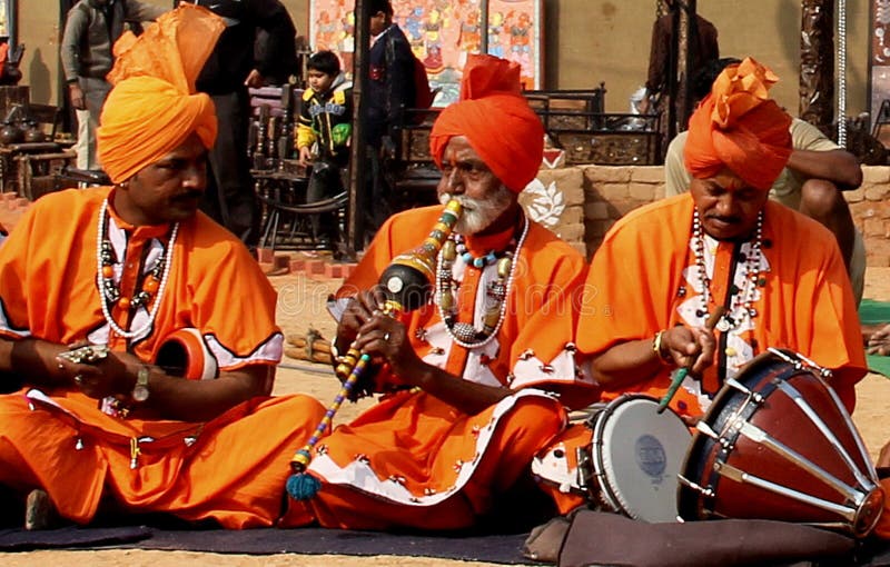 This was shot at 7th Chandigarh National Crafts Mela, Kakagram, Chandigarh, India. These are the artists playing Folk Music and dance of Haryana, India. They are in their traditional attire, jewellery and singing and dancing to the songs with the musical instruments like been the one used by snake charmers, iktara, duggi, khartal etc. They use shells, beads, mirrors in the jewellery. Vermillion is put on the forehead. This was shot at 7th Chandigarh National Crafts Mela, Kakagram, Chandigarh, India. These are the artists playing Folk Music and dance of Haryana, India. They are in their traditional attire, jewellery and singing and dancing to the songs with the musical instruments like been the one used by snake charmers, iktara, duggi, khartal etc. They use shells, beads, mirrors in the jewellery. Vermillion is put on the forehead.