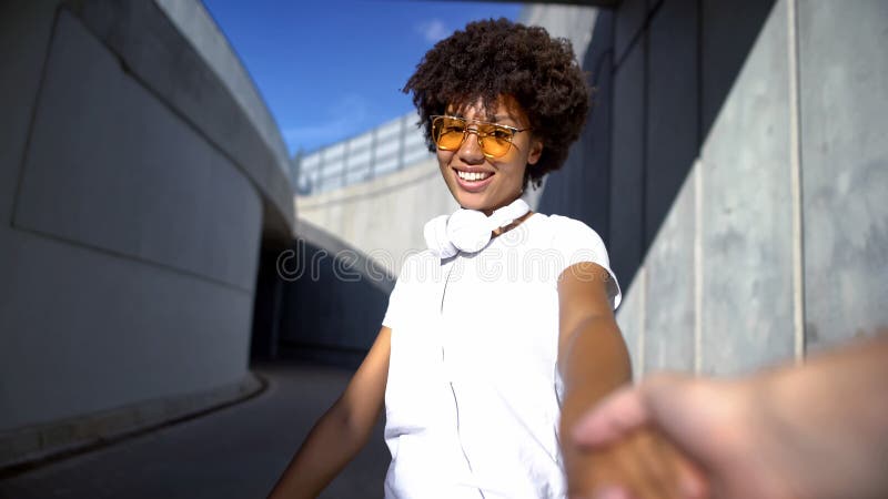 Follow me couple, beautiful afro-american woman looking at camera, travelling stock photography Follow me couple, beautiful afro-american woman looking at camera, travelling stock photography