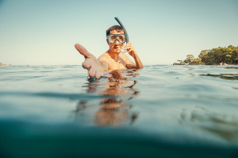 Follow me and learn basics of snorkeling recreation. Sea depths and leisure at the resort. Exotic fish and coral reefs are closer stock photography