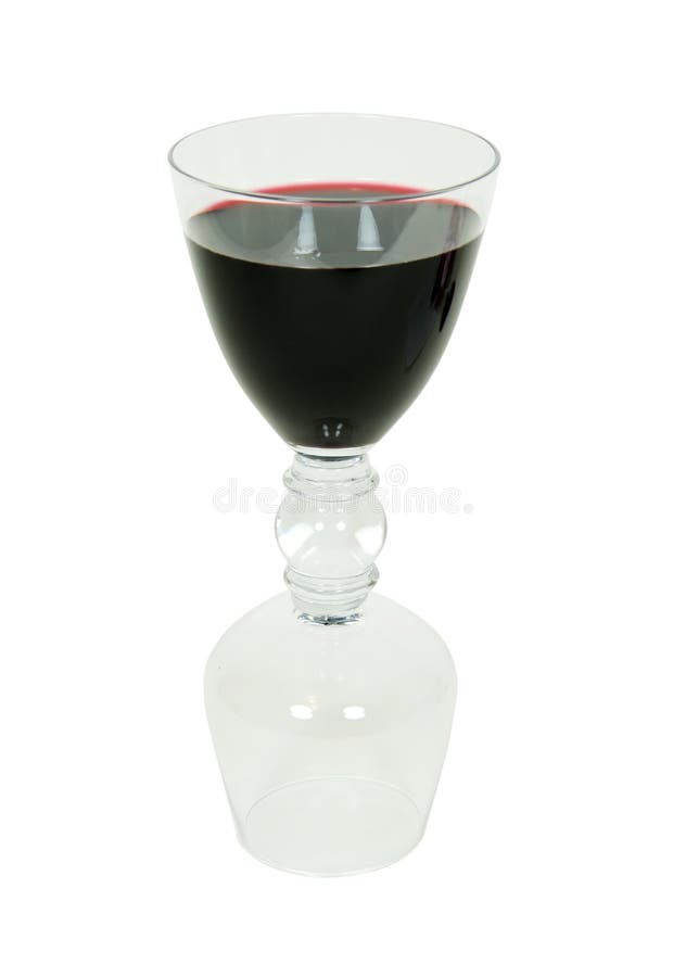 Dark red wine in half of a double drinking glass which holds a wine and brandy snifter at each end. Dark red wine in half of a double drinking glass which holds a wine and brandy snifter at each end