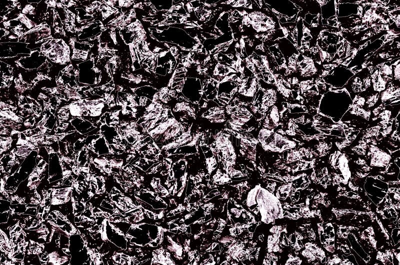 Fond abstract constă în textura pietrelor mici de culoare neagră și argintie. royalty free stock images