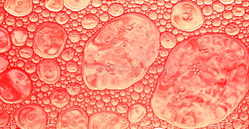 Fond abstrait coloré dans les tons rouges, baisses d'huile sur une surface de l'eau photo libre de droits Fond abstrait coloré dans les tons rouges, baisses d'huile sur une surface de l'eau photo libre de droits