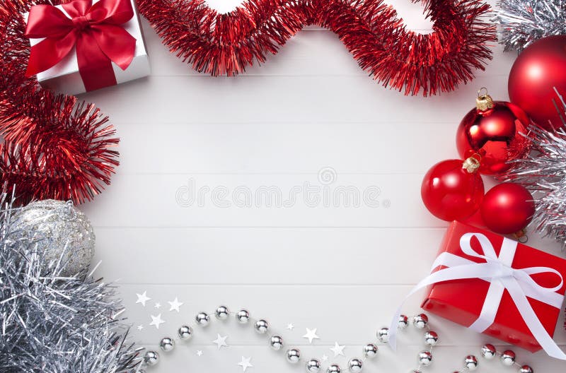 A Christmas background with a red and white theme. With presents, decorations and tinsel. Please see my extensive range of Christmas images. A Christmas background with a red and white theme. With presents, decorations and tinsel. Please see my extensive range of Christmas images.