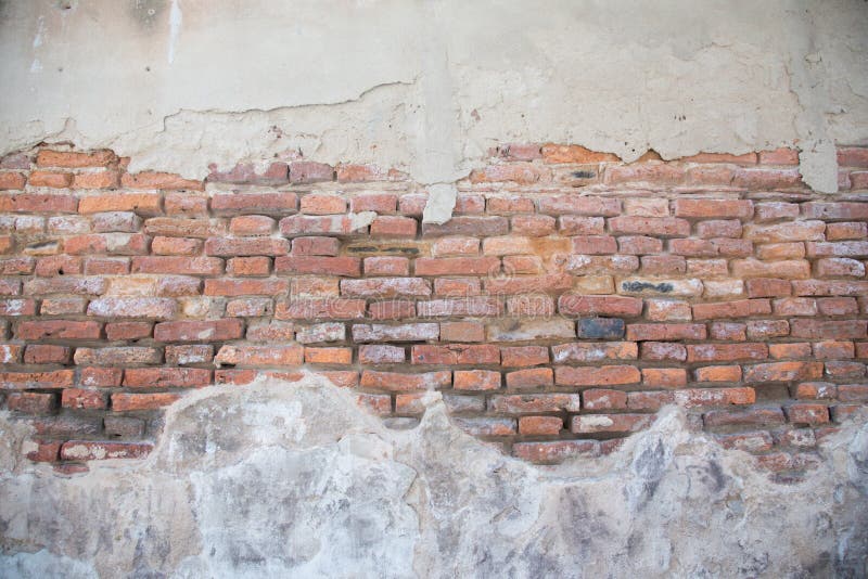 Fond concret criqué de mur de briques de cru photographie stock Fond concret criqué de mur de briques de cru photographie stock