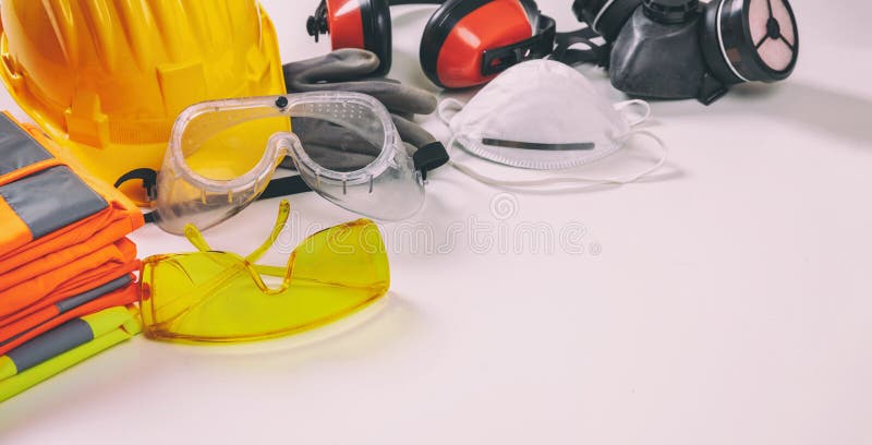 Work safety protection equipment flat lay. Industrial protective gear on white background, closeup view. Construction site health and safety concept. Work safety protection equipment flat lay. Industrial protective gear on white background, closeup view. Construction site health and safety concept