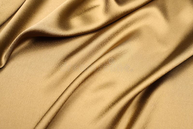 Silky smooth and soft gold satin cloth background with nice foldings. Silky smooth and soft gold satin cloth background with nice foldings