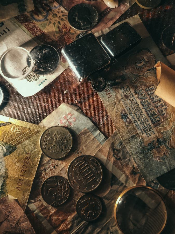 Background of old coins. Paper with a pattern studded with old coins.