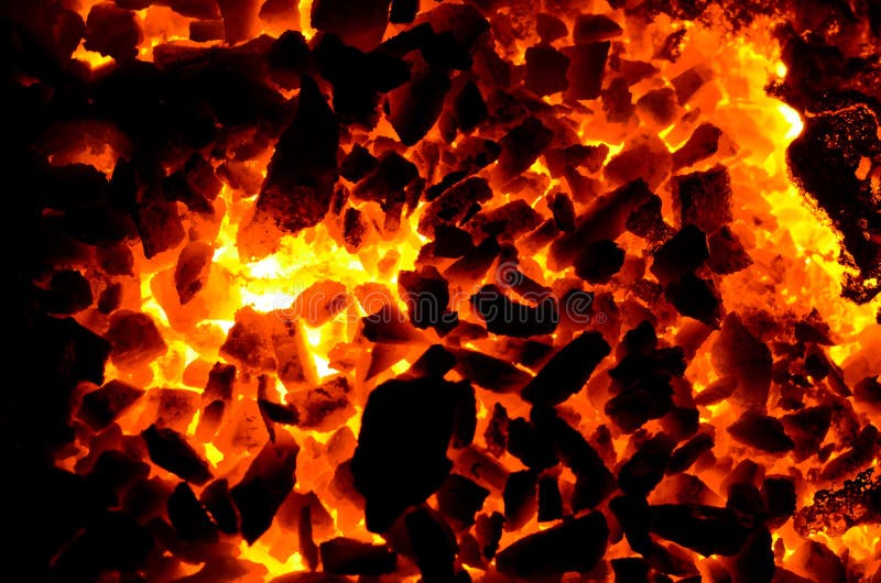 Fond luminos constă în textura cărbunelui cald. stock photo