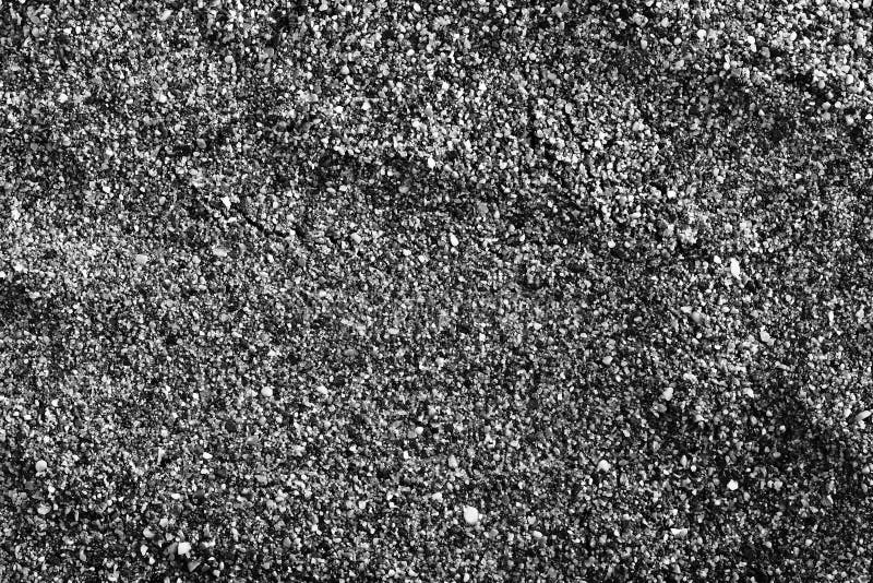 Fond texturisé de sable dans le monochrome images stock