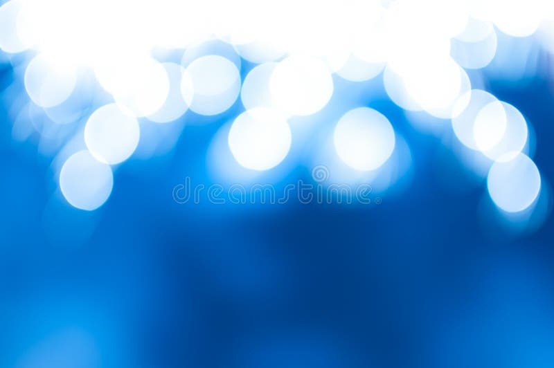 Magical blue abstract background with blurred defocused sparkles and bokeh. Magical blue abstract background with blurred defocused sparkles and bokeh