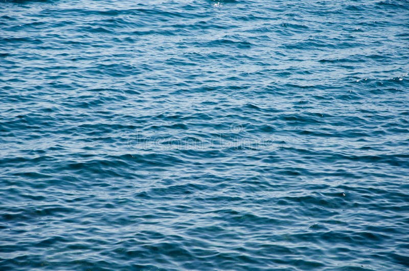 Fondo abstracto del mar, superficie de la ondulación del agua azul fotografía de archivo Fondo abstracto del mar, superficie de la ondulación del agua azul fotografía de archivo