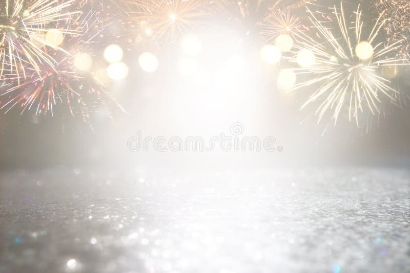 Abstract gold and silver glitter background with fireworks. christmas eve, 4th of july holiday concept. Abstract gold and silver glitter background with fireworks. christmas eve, 4th of july holiday concept.