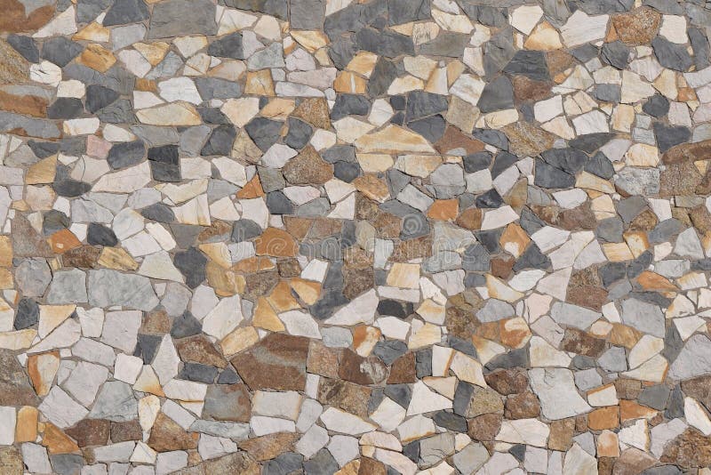 Fondo colorato dell'estratto della parete di pietra fotografia stock Fondo colorato dell'estratto della parete di pietra fotografia stock