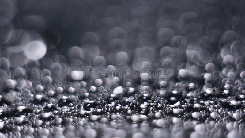 Fondo de Bokeh de descensos grandes del agua en fondo gris Fondo abstracto de la descripción almacen de metraje de vídeo