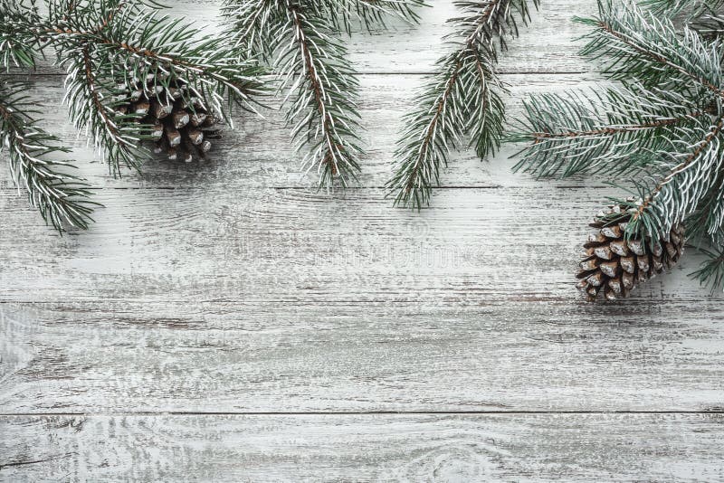 Christmas background with fir tree and decoration on dark wooden board. Flat lay, top view. Christmas, New Year`s composition with copy space for text. Christmas background with fir tree and decoration on dark wooden board. Flat lay, top view. Christmas, New Year`s composition with copy space for text.