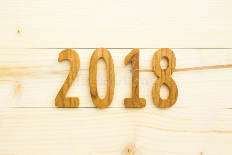 Wood figures 2018 on wood table for happy new year background. Wood figures 2018 on wood table for happy new year background.