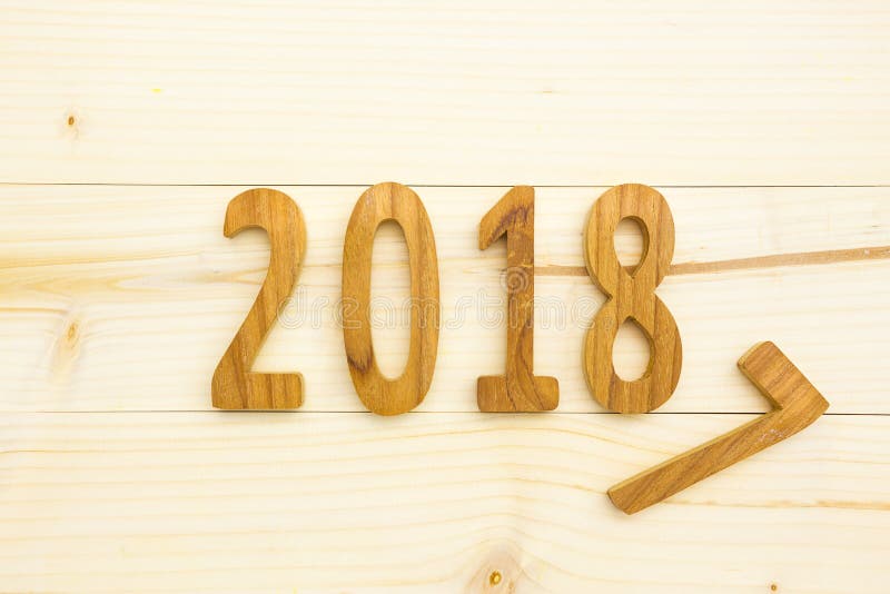 Wood figures 2018 on wood table for happy new year background. Wood figures 2018 on wood table for happy new year background.