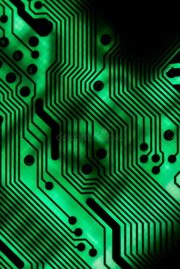 Green circuit board closeup lit from below through the board, creating a unique glow effect. Green circuit board closeup lit from below through the board, creating a unique glow effect.