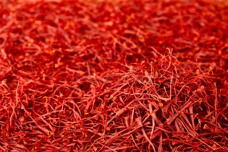 Fondo dell'alimento della spezia secca del filo dello zafferano immagine stock libera da diritti Fondo dell'alimento della spezia secca del filo dello zafferano immagine stock libera da diritti