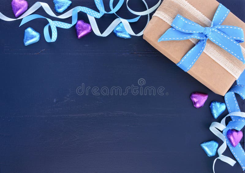 Happy Fathers Day background on dark blue distressed wood table with decorated borders. Happy Fathers Day background on dark blue distressed wood table with decorated borders.