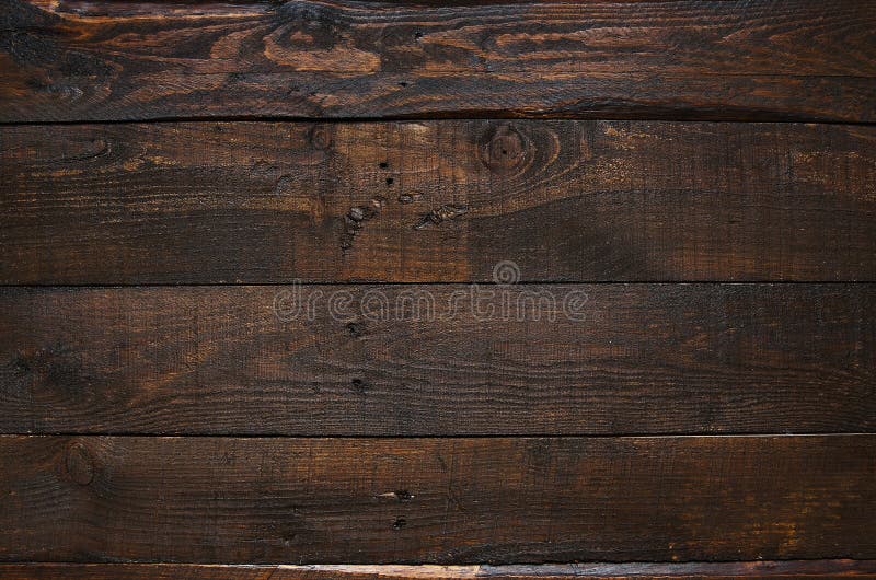 Fondo di legno invecchiato rustico delle plance del granaio di marrone scuro
