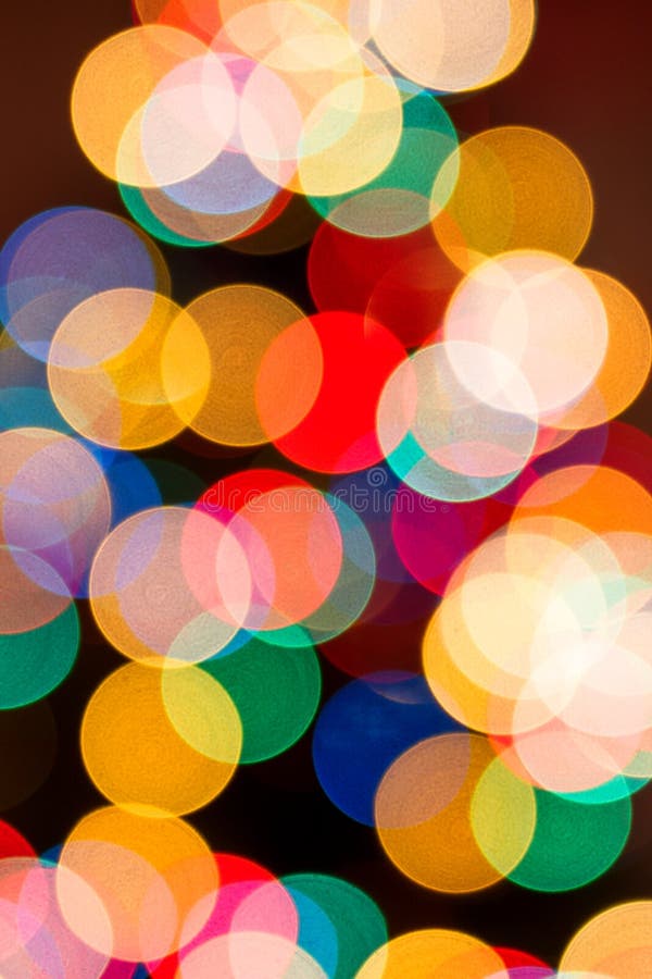 Fondo di Natale alle luci defocused Bokeh variopinto fotografia stock Fondo di Natale alle luci defocused Bokeh variopinto fotografia stock