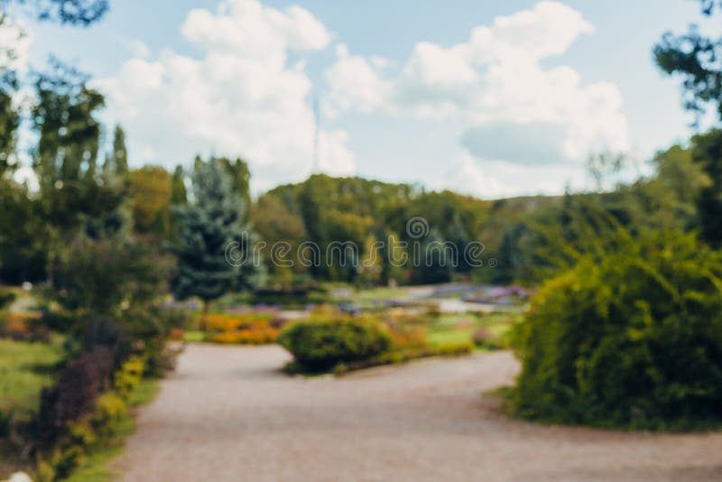 Fondo hermoso del bokeh del parque de la ciudad del paisaje de la falta de definición del extracto con luz del sol en d3ia foto de archivo Fondo hermoso del bokeh del parque de la ciudad del paisaje de la falta de definición del extracto con luz del sol en d3ia foto de archivo