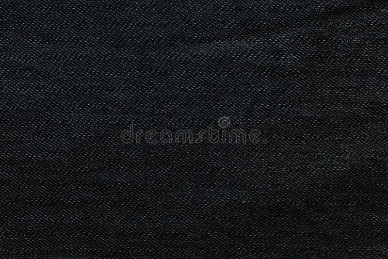 Fondo nero, fondo dei jeans del denim I jeans strutturano, tessuto