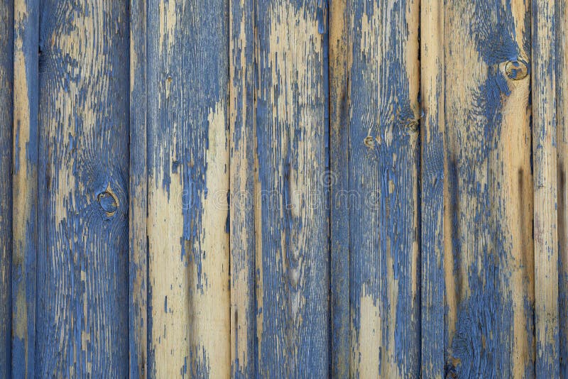 Fondo o textura de madera amarillo con la peladura de la pintura azul fotografía de archivo Fondo o textura de madera amarillo con la peladura de la pintura azul fotografía de archivo