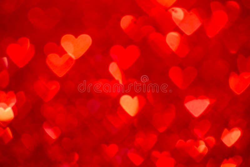 Fondo rosso del bokeh del cuore Struttura di giorno di biglietti di S. Valentino fotografie stock libere da diritti Fondo rosso del bokeh del cuore Struttura di giorno di biglietti di S. Valentino fotografie stock libere da diritti