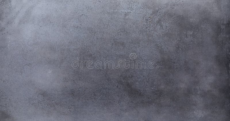 A rustic dark empty blackboard background in a panoramic aspect ratio. A rustic dark empty blackboard background in a panoramic aspect ratio.