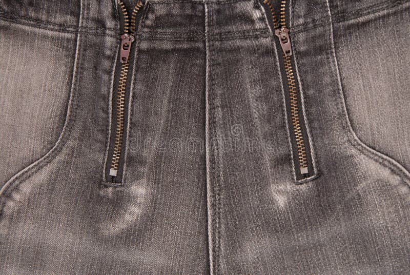 Fondos grises del dril de algodón, cierre para arriba de los vaqueros, pantalones de moda imagenes de archivo Fondos grises del dril de algodón, cierre para arriba de los vaqueros, pantalones de moda imagenes de archivo