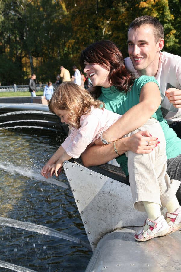 Happy family near the fontain. Happy family near the fontain