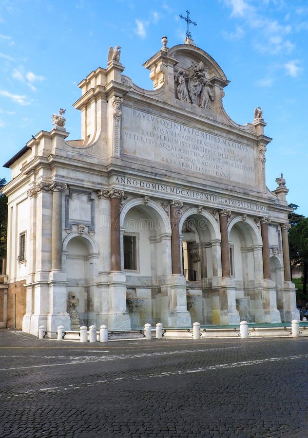 View of The Fontana dell`Acqua Paola  located on the Janiculum Hill, near the church of San Pietro in Montorio, in Rome, Italy.  Also known as Il Fontanone the monumental fountain was built in 1612 to mark the end of the Acqua Paola aqueduct, restored by Pope Paul V, and took its name from him. It was the first major fountain on the right bank of the River Tiber. Pope Paul V decided to rebuild and extend the ruined Acqua Traiana aqueduct built by the Emperor Trajan in order to create a source of clean drinking water for the residents of the Janiculum Hill. The fountain was designed by the architect Giovanni Fontana. Five abundant streams poured through the arches into five marble basins. In 1690 Carlo Fontana designed an additional semicircular pool for the water which overflowed from the marble basins. View of The Fontana dell`Acqua Paola  located on the Janiculum Hill, near the church of San Pietro in Montorio, in Rome, Italy.  Also known as Il Fontanone the monumental fountain was built in 1612 to mark the end of the Acqua Paola aqueduct, restored by Pope Paul V, and took its name from him. It was the first major fountain on the right bank of the River Tiber. Pope Paul V decided to rebuild and extend the ruined Acqua Traiana aqueduct built by the Emperor Trajan in order to create a source of clean drinking water for the residents of the Janiculum Hill. The fountain was designed by the architect Giovanni Fontana. Five abundant streams poured through the arches into five marble basins. In 1690 Carlo Fontana designed an additional semicircular pool for the water which overflowed from the marble basins.