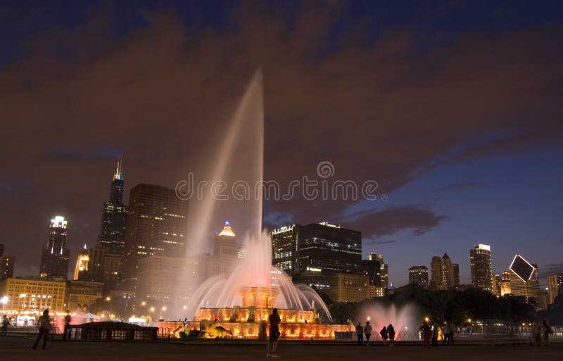 Buckingham Fountain by night with the chicago skyline in the background. Buckingham Fountain by night with the chicago skyline in the background