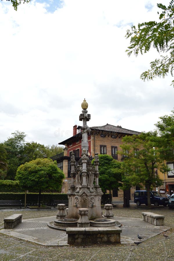 Wonderful Fountain Of The Three Spouts On A Cloudy Day In Quotation Marks. August 26, 2013. Comillas, Cantabria. Holiday Nature Street Photography. Wonderful Fountain Of The Three Spouts On A Cloudy Day In Quotation Marks. August 26, 2013. Comillas, Cantabria. Holiday Nature Street Photography