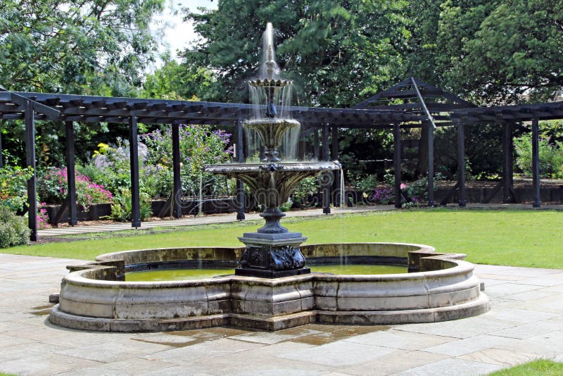 Photo of an ornamental tiered fountain with nd filter used to make special effect on water. Photo of an ornamental tiered fountain with nd filter used to make special effect on water.