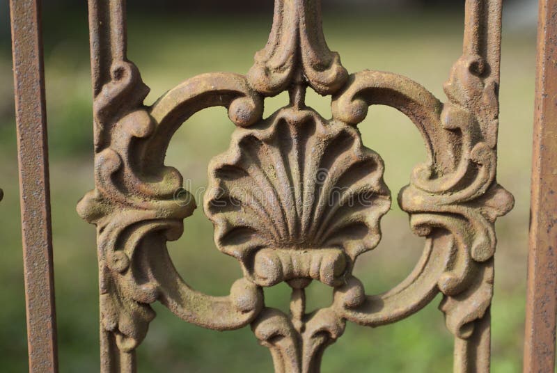 Rusty Shell detail in a cast iron fence. Rusty Shell detail in a cast iron fence.