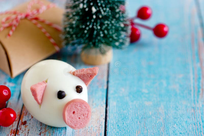 Food art - edible pig from boiled egg and sausage symbol chinese New Year 2019