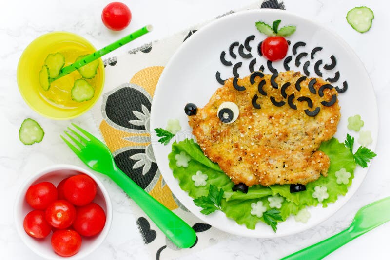 Food art idea for kids lunch - chicken schnitzel with vegetables stock photos Food art idea for kids lunch - chicken schnitzel with vegetables stock photos