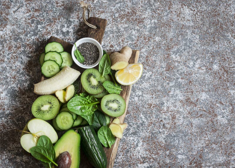 Food Background. Detox Green Vegetables and Fruits on a Wooden Board ...