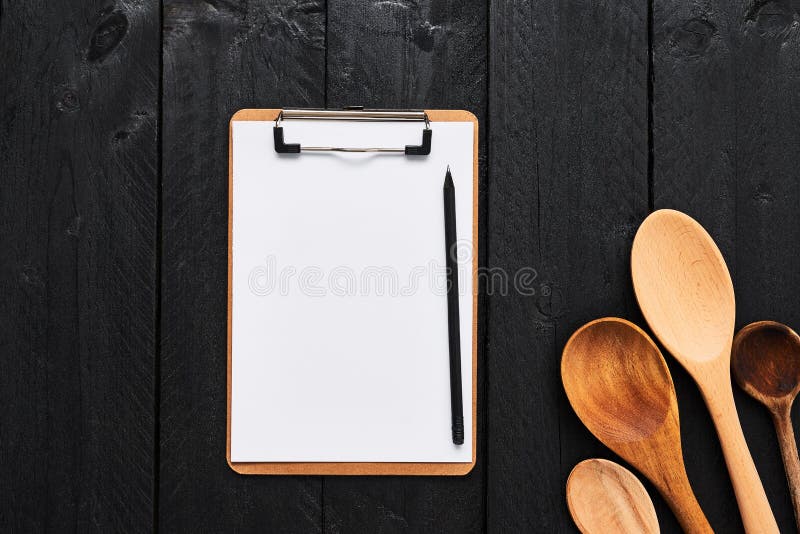 Wooden spoons with blank cardboard clipboard for menu stock photos Wooden spoons with blank cardboard clipboard for menu stock photos