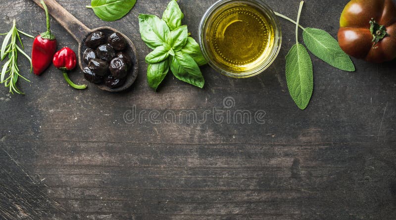 Food background with vegetables, herbs and condiment. Greek black olives, fresh basil, sage, rosemary, tomato, peppers