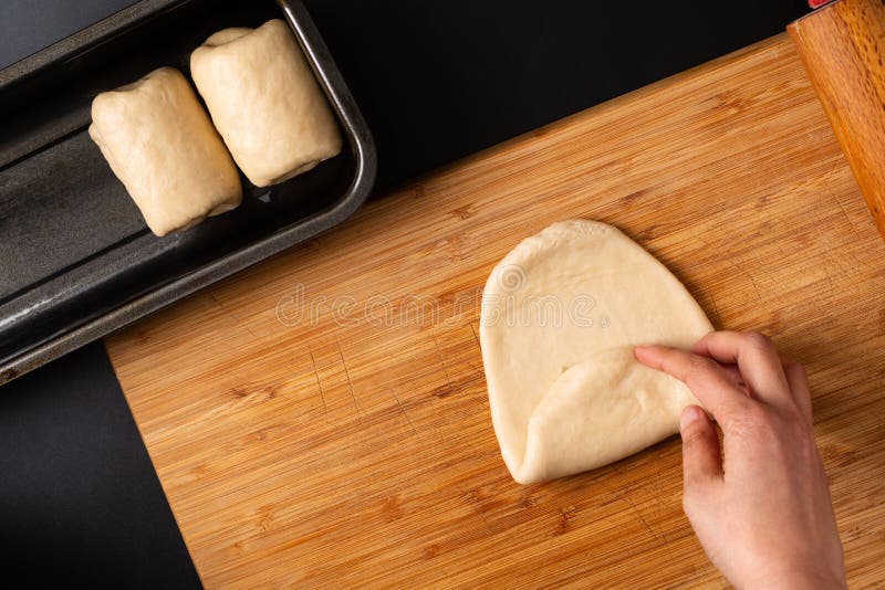 Food Baking concept Making organic homemade soft milk loaf bread in loaf pan on wooden board with copy space